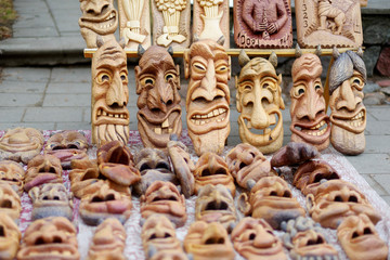 Funny and frightening wooden masks sold on Easter market in Vilnius