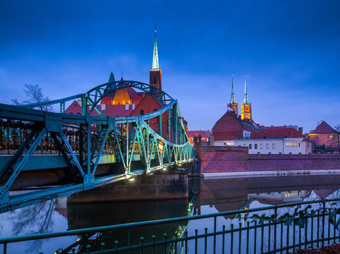famous old bridge on island Tumski(Ostrów Tumski) with cathedral of St. John at dusk. Wroclaw, Poland, EU. A long time shutter exposure.