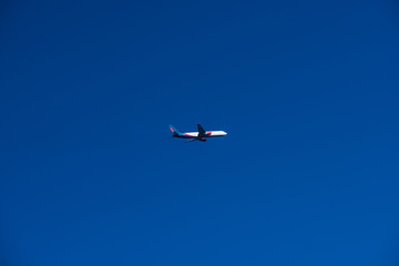 Airplane Flying in the blue sky