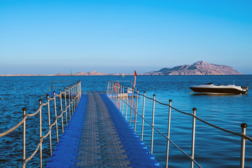 Fototapeta na wymiar pontoon in the Red Sea, boat and Tiran Island
