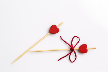 Three handmade heart cupcake toppers on white background