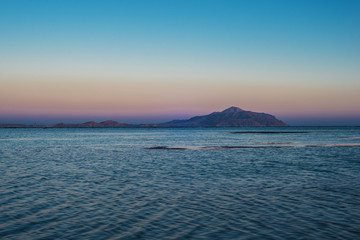 Tirant island and the Red Sea in the evening at sunset.