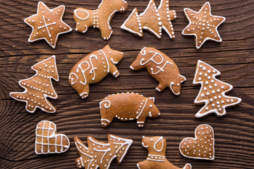 Gingerbread Christmas cookie background. Christmas homemade gingerbread cookies on wooden background.