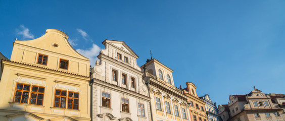 Architectural gable selection under blue sky, Prague.