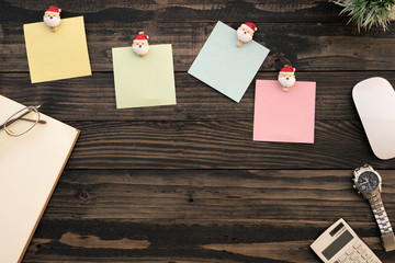 Top view desk of work wood table in office with laptop computer , notebook and stationary for creative business work or marketing plan to success planning of company