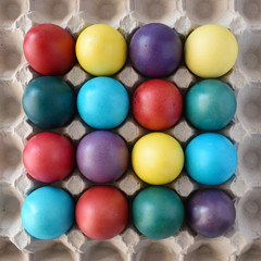 Colorful Easter eggs in paper container.