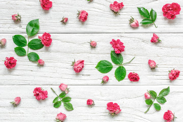 Flowers composition made of pink rose flowers with green leaves. Valentine's day background