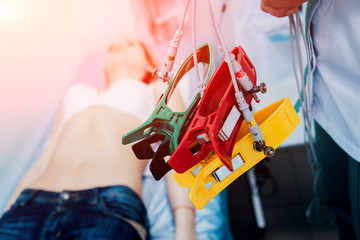 Doctor with electrocardiogram equipment making cardiogram test