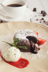 Chocolate fondant with vanilla ice cream and strawberry