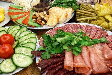 home celebratory table served with various cold appetizers, abundance holiday dinner