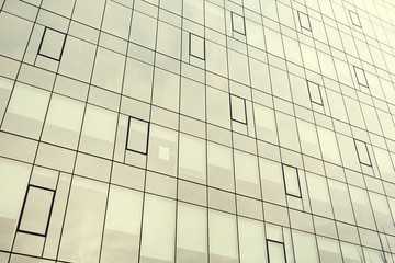 Facade of a modern office building. Modern industrial building with glass. Abstract background.