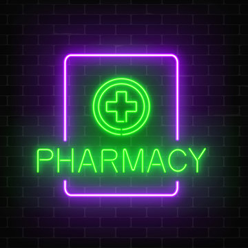 Glowing neon pharmacy signboard on a dark brick wall background. Illuminated drugstore sign with neon effect.