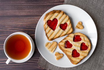 Grilled toast with raspberry jam and tea