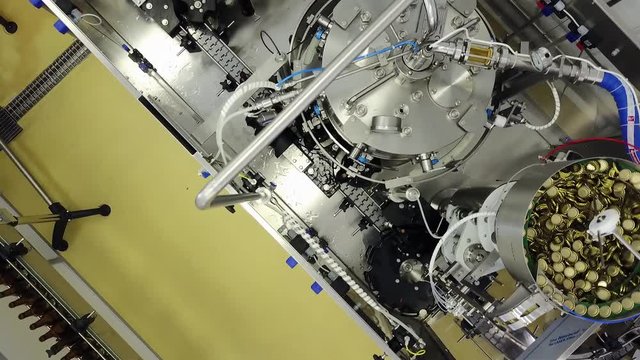 Automatic Beer Bottling Line at the craft Brewery.  Shooting with drone.