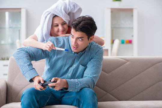 Wife and husband looking at pregnancy test