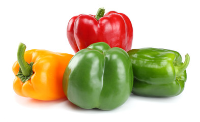 four green, red, yellow sweet bell peppers isolated on white background