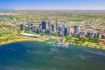 Aerial view of Perth Skyline in Australia. Scenic flight over Elizabeth Quay, Bell Tower, Elizabeth Quay Bridge, Swan River, Perth Convention and Exhibition Center in Western Australia. Copy space. - obrazy, fototapety, plakaty