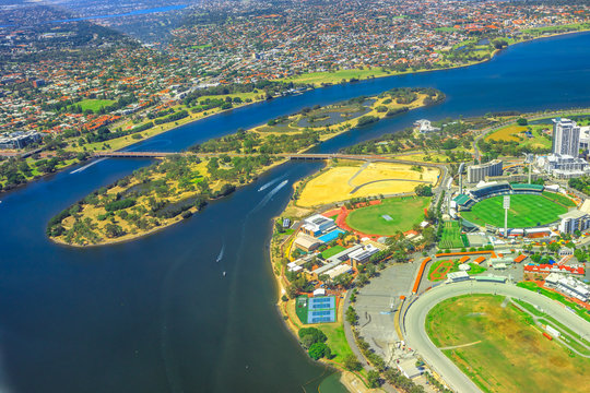 Aerial view of Perth and Swan River in Australia. Scenic flight over Heirisson Island, New Perth Stadium, Cricket Pitch, WACA Ground in Western Australia.