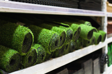 Rolls of artificial grass sale on the shelf