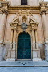 Fototapeta na wymiar Door of Saint John the Baptist church, Ragusa