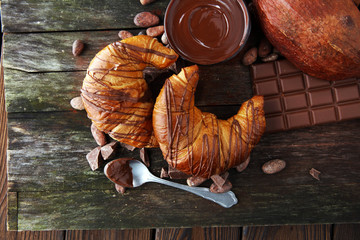 Fresh homemade croissants with chocolate. Sweet bakery concept.