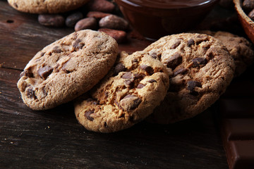 Chocolate cookies on wooden table. Chocolate chip cookies shot.