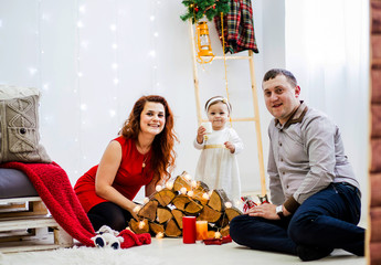 Happy family posing in the studio