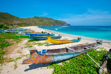 Fototapeta na wymiar Fishing boats on Mawun beach - Lombok, Indonesia.