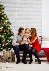 Happy family poses in the studio