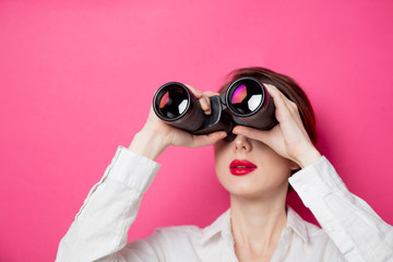 Portrait of young  businesswoman with binoculars