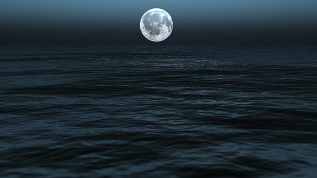 Moonlight path with low fool moon above the sea