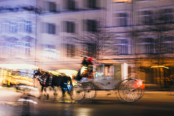 abstract image of blur motion of  horse-drawn carriage in the city road