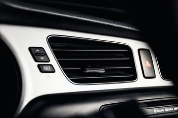 Obraz na płótnie Canvas Car air conditioner, interior of a new modern car