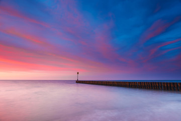 Obraz premium Sunset on the beach, long time exposure