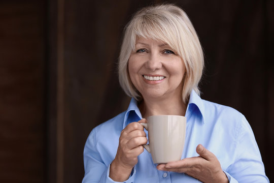 Beautiful Mature Woman Drinking Coffee At Home