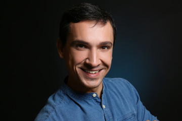 Obraz premium Attractive young man on black background