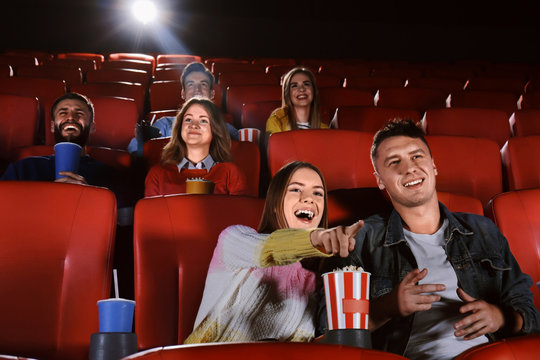 Young People Watching Movie In Cinema