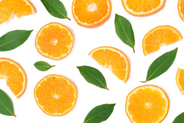 Fototapeta na wymiar Slices of orange or tangerine with leaves isolated on white background. Flat lay, top view. Fruit composition