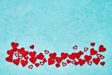 Valentines Day background. Red hearts on blue background. Top view, copy space