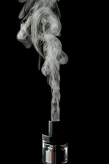 Electronic cigarette with vapor isolated on a black background