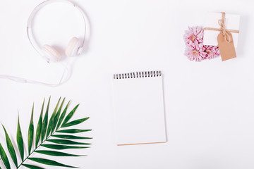 Notepad, headphones and gift box