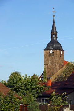 he wooden Steeple of the Village Church overseeing Schlepzig in the Spreewald Area in Brandenburg Province of Germany