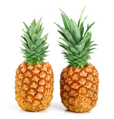 Two ripe pineapple isolated on white background
