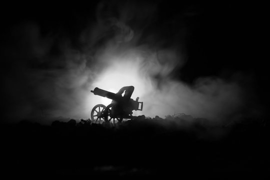 War Concept. Military silhouettes fighting scene on war fog sky background, World War Soldiers Silhouettes Below Cloudy Skyline At night. Attack scene.