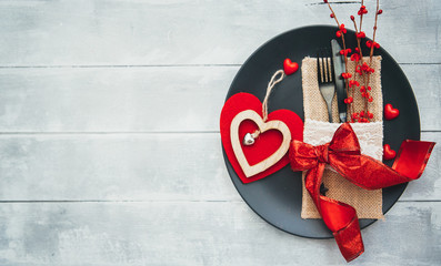 Romantic dinner concept. Festive table setting for Valentines Day on wooden background.