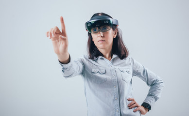 Woman wearing augmented reality goggles.