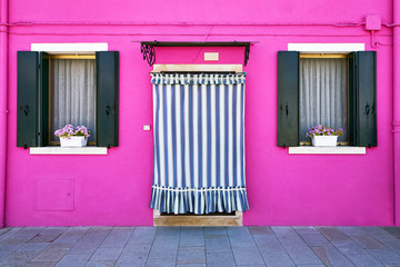 Front of the pink house on the island of Burano, Venice, Italy
