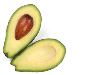 whole and half avocado isolated on white background close-up with copy space for your text. Top view. Flat lay pattern
