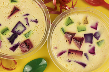 Colorful gelatin over yellow background. Brazilian famous sweet.