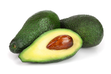 whole and half avocado isolated on white background close-up. Top view